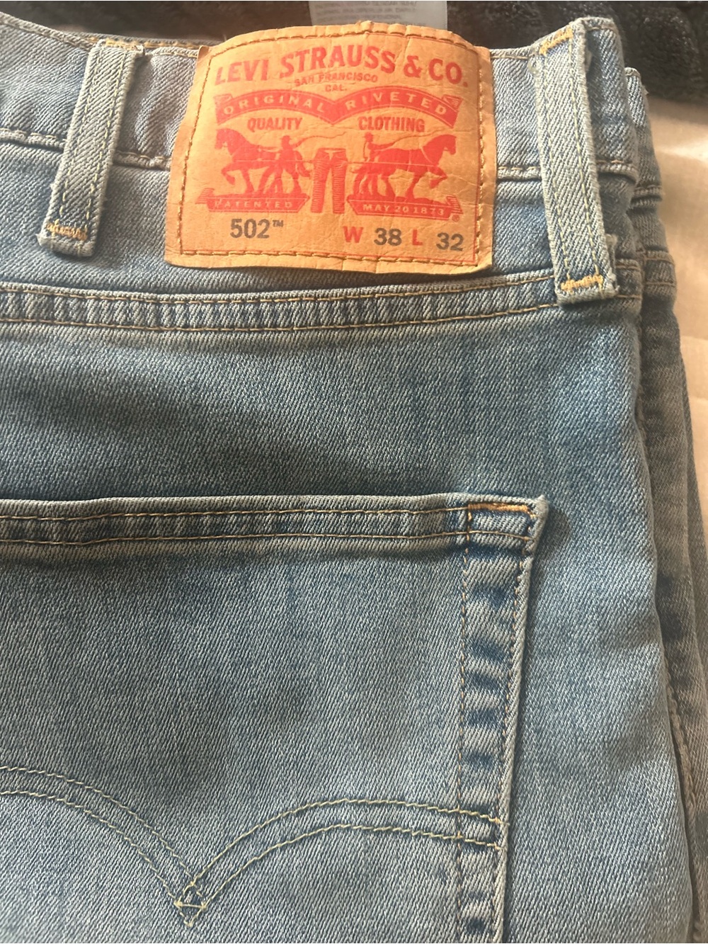 2 INCH HEM, length is 30. LEVI’S 502 Light Blue Denim Jeans